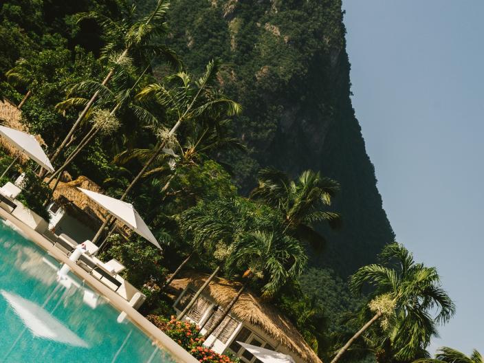 A beautiful beach surrounded by lush green mountains.