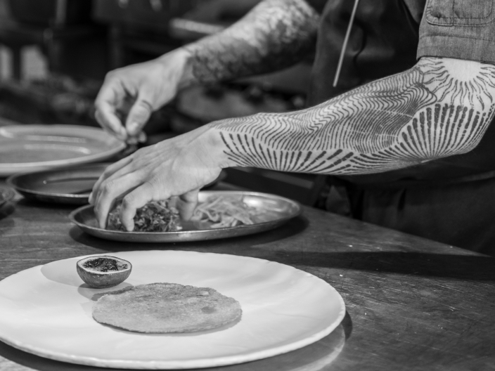 A chef prepares a unique dish offered at Viceroy Riviera Maya.