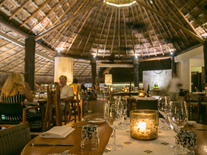 The beautiful interior of La Marea restaurant, lit by candlelight.