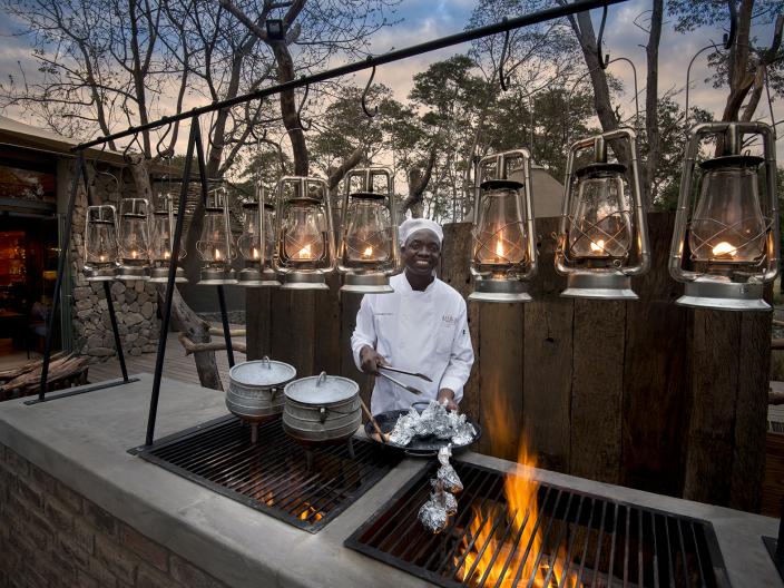 Man cooking over fire