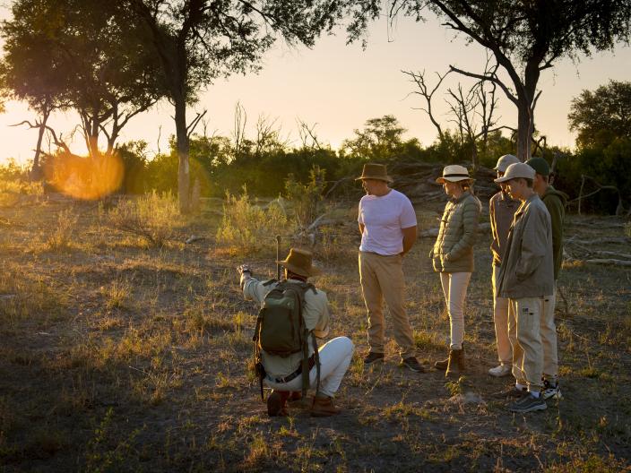 guide with hikers on safari