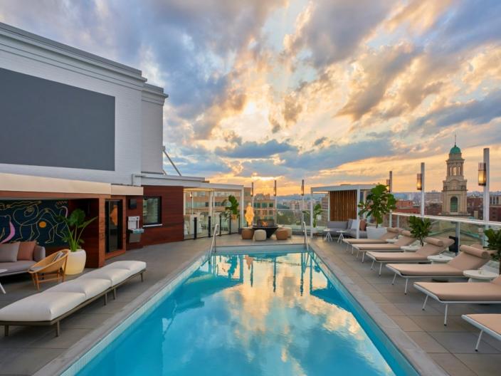 image of Hedy's rooftop at hotel Zena with the sun peeping between clouds