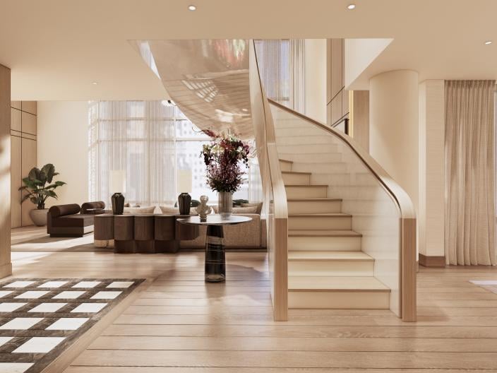 A spacious modern living room with a curved staircase, pale wood floors, a dark lounge area, a flower arrangement, and large curtained windows.