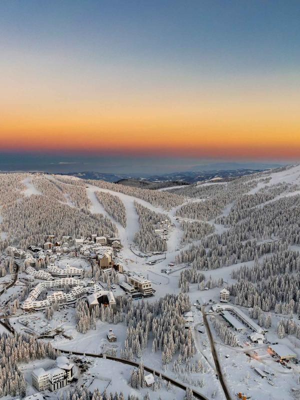 sunrise over snow covered mountains around Viceroy Kopaonik