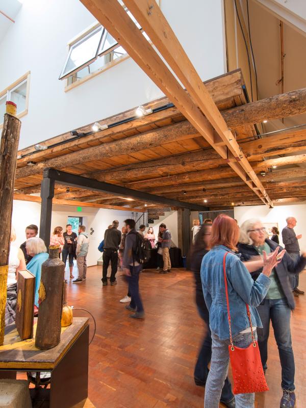 crowd standing inside of Anderson Ranch