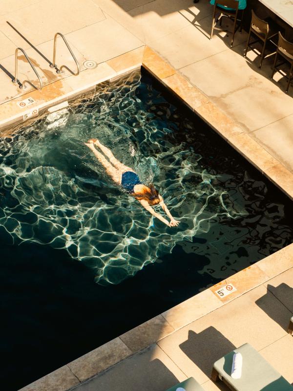 aerial view of woman swimming in pool