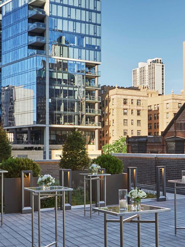 outdoor rooftop venue set with high square tables