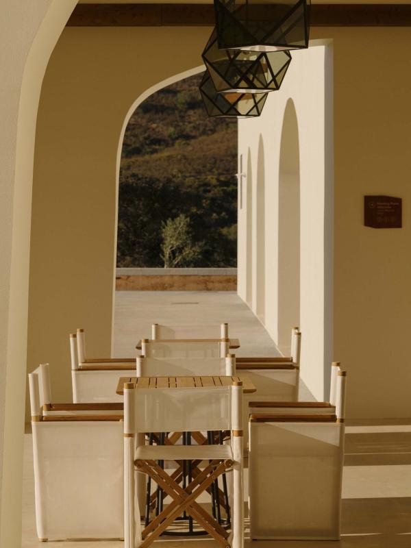 covered outdoor dining area with long table