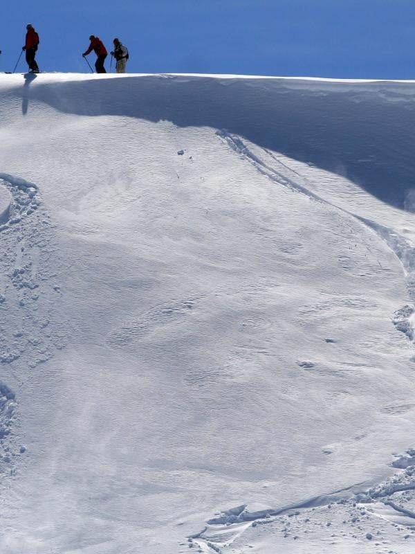 A skiier descends off-piste on an unkempt slope in the Kopaonik mountains