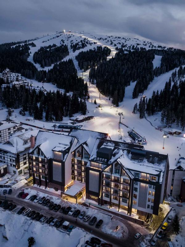 An aerial view of Viceroy Kopaonik Serbia, with the ski slope behind it