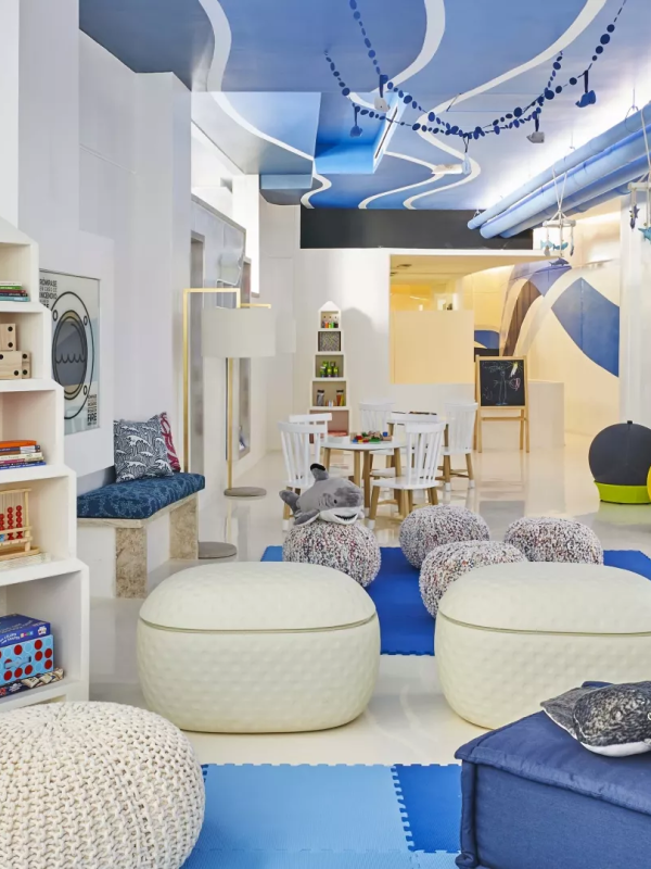 A kids play area with coloring tables and relaxing areas at Viceroy Los Cabos