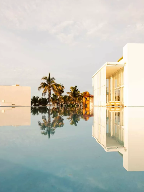 A pool surrounding part of the exterior of Viceroy Los Cabos