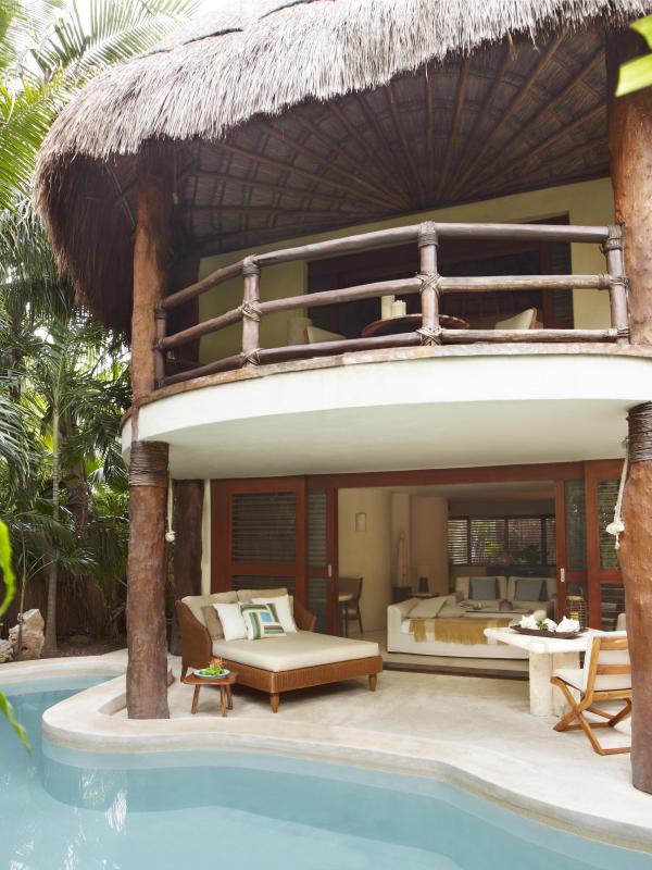 Exterior of a room at Riviera Maya with a private pool and lounge area
