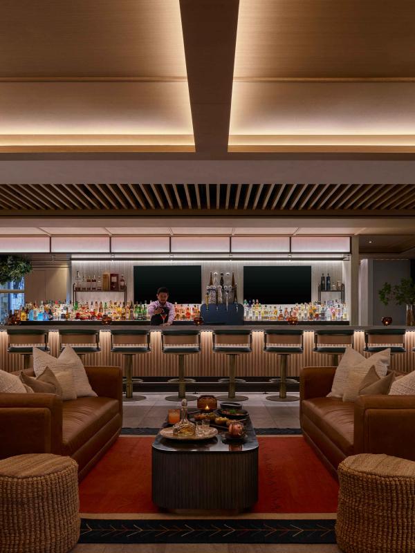 A bartender prepares a cocktail in the Viceroy Lounge at Viceroy Snowmass.