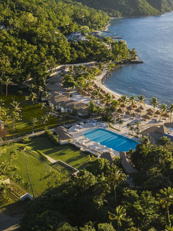 Overhead view of Viceroy Sugar Beach property with the ocean, pools, and green areas