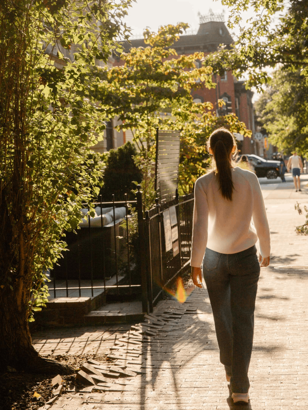 A woman walking down the street in Washington DC