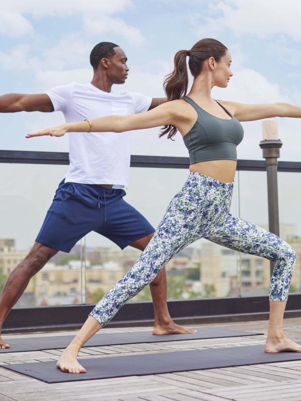 Two people doing yoga