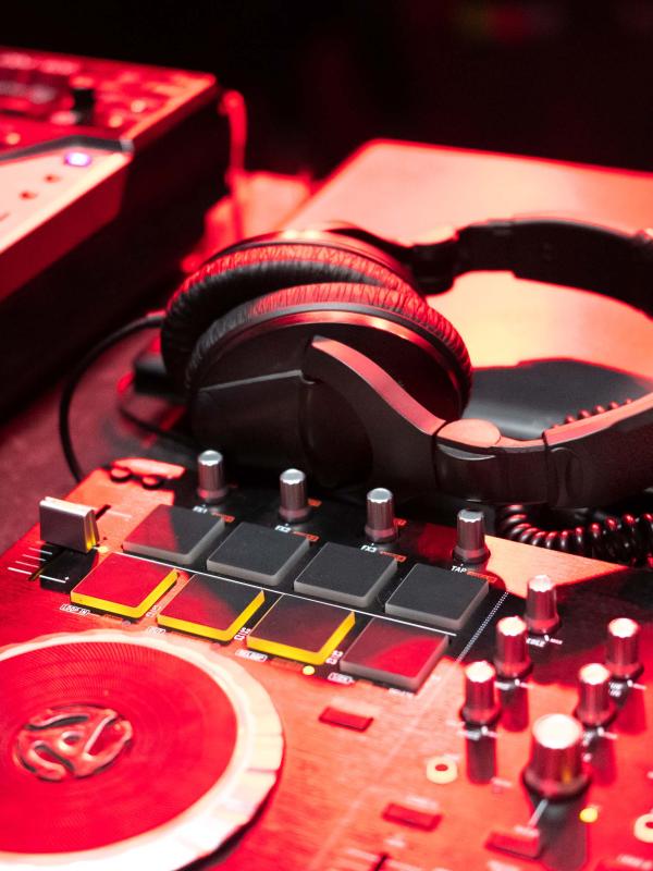 red disc jockey turntable and headphones