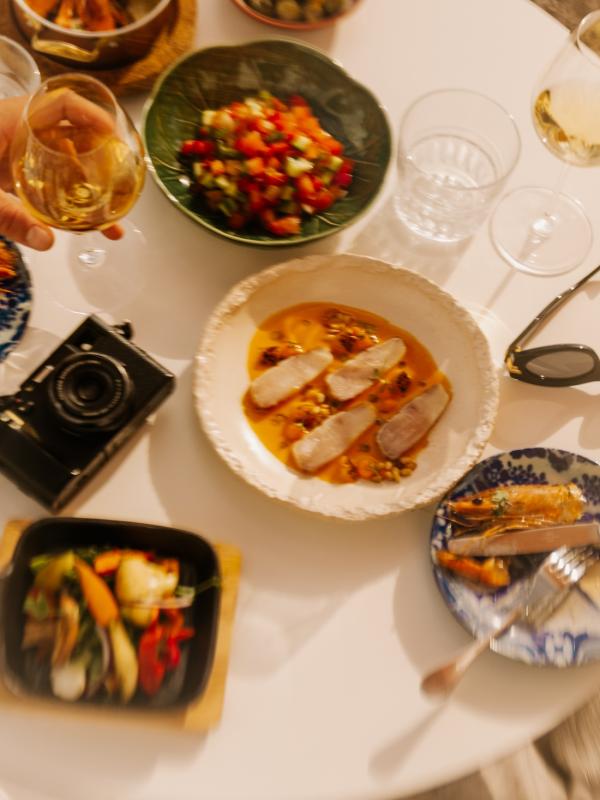 plates of food and personal items on table