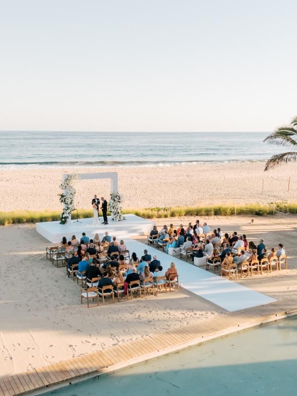 aerial view of beach with wedding set-up