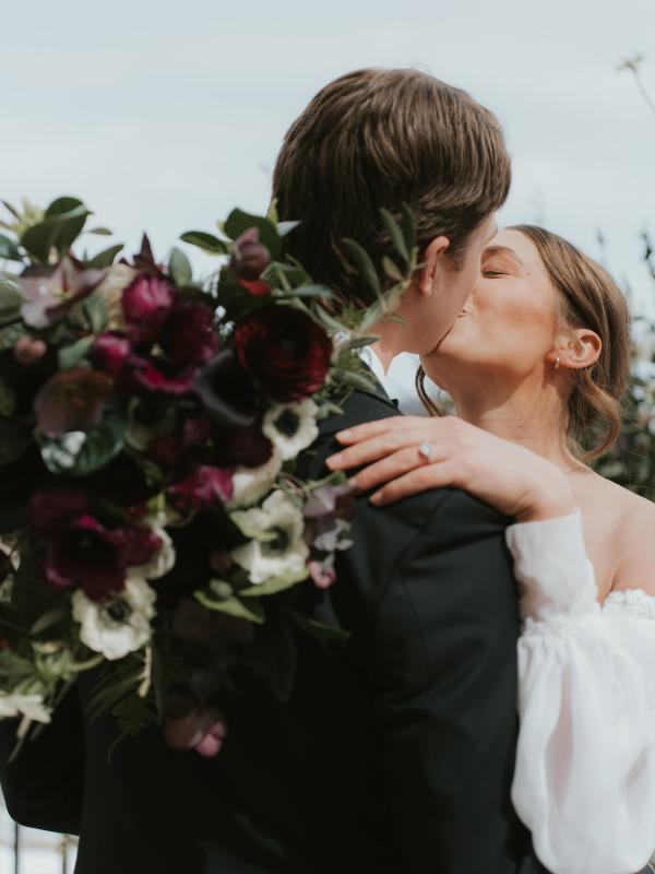 A bride and groom kissing on their wedding day