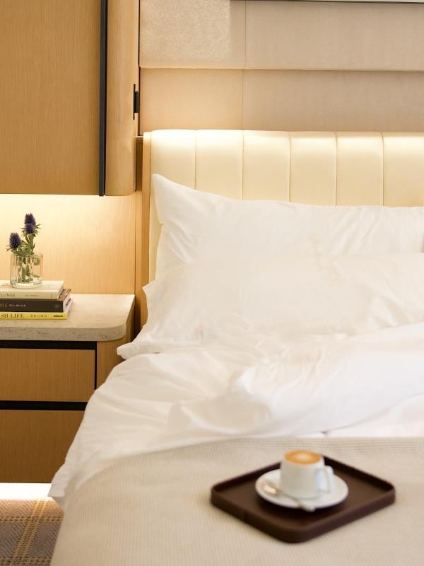 Guestroom bed and side,table at The Observatory Sun Valley, A Viceroy Resort