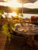A patio table at Salpico at sunset
