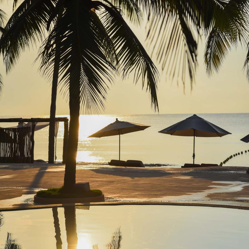 A sun set at a beach resort