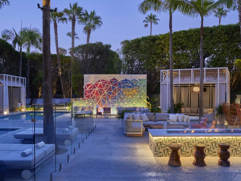 Outdoor meeting area with cabanas. and various seating options