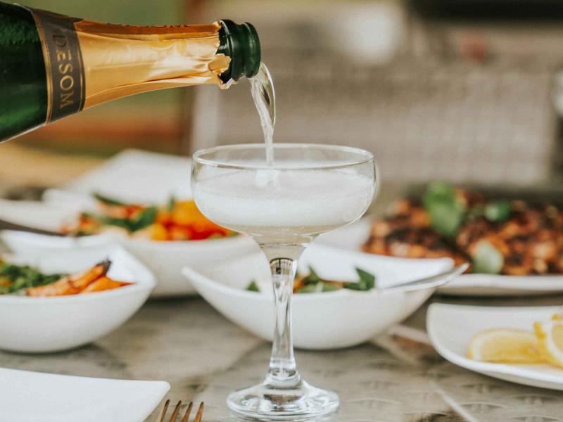 champagne poured into coupe glass