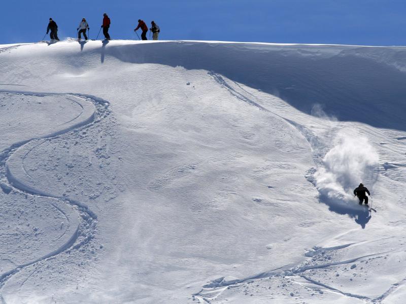 A skiier descends off-piste on an unkempt slope in the Kopaonik mountains