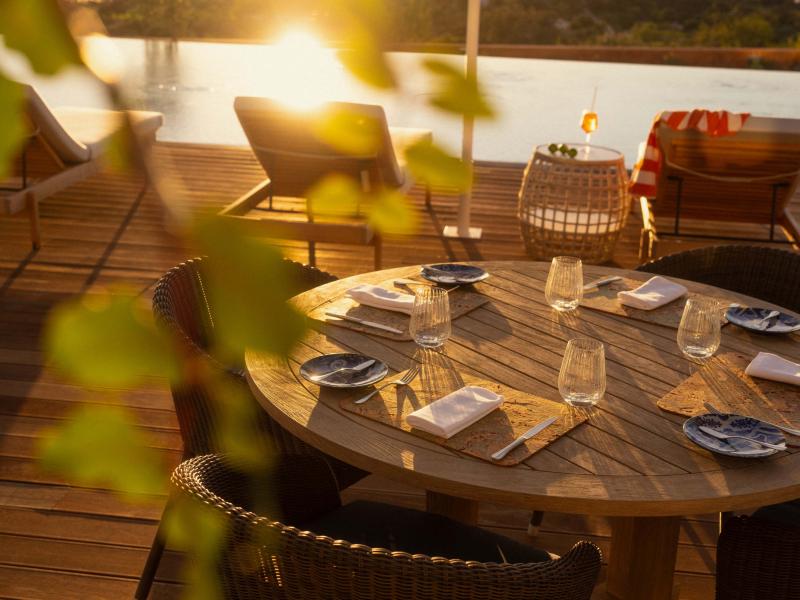 A patio table at Salpico at sunset