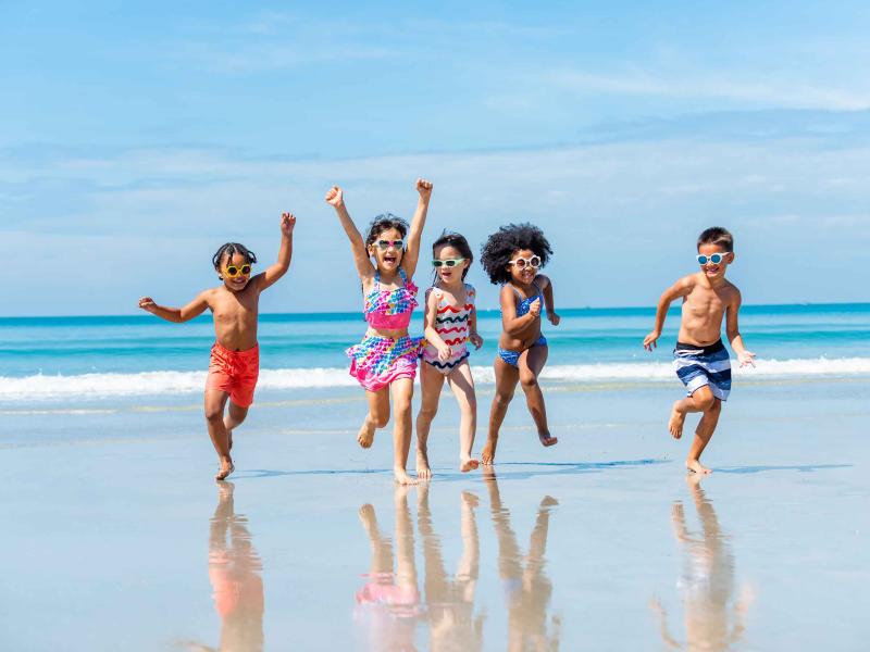 Children running on the Santa Monica beach