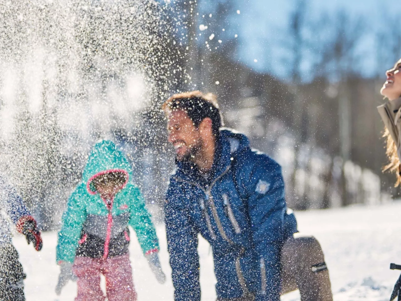 A family playing in the snow at Viceroy Serbia