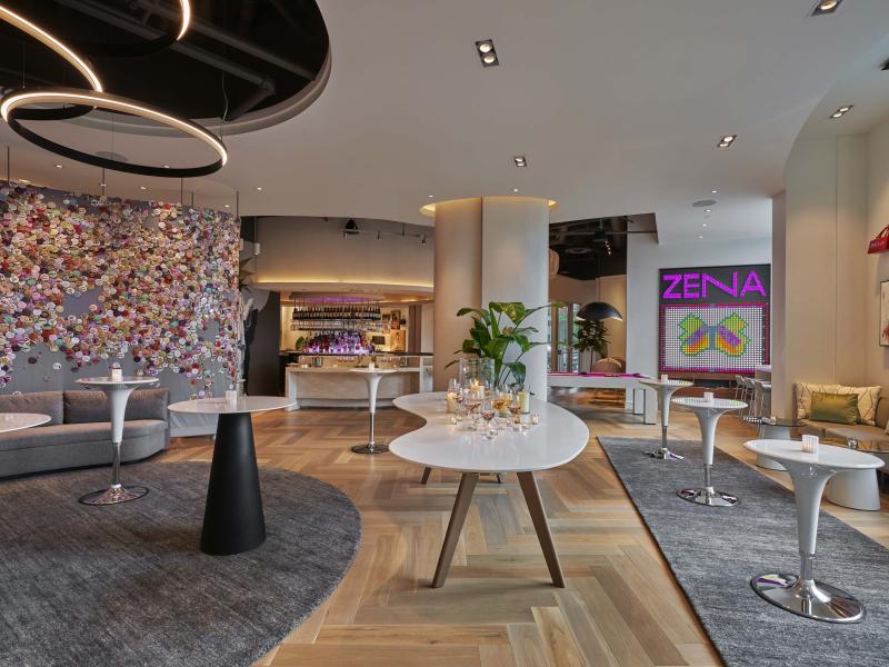 Figleaf, a trendy open bar area at Hotel Zena with an accent wall decorated by buttons