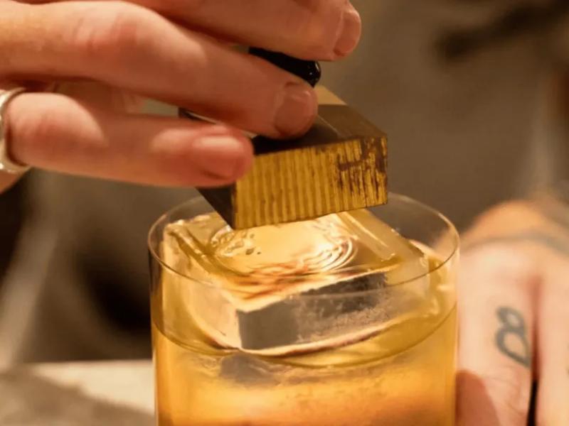 A closeup of a cocktail being made